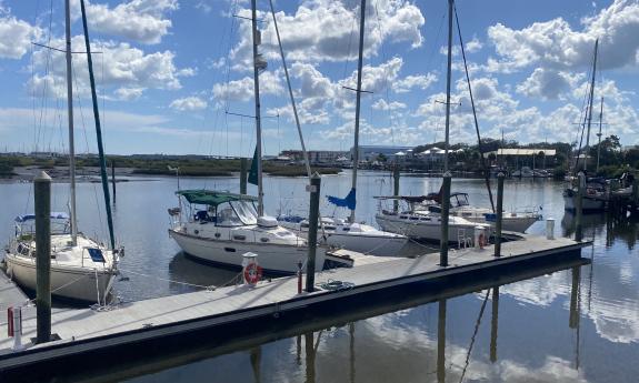 Boats docked at the marina in front of the food truck lot