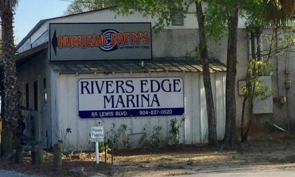 The front exterior of the marina building and Hurricane Patty's restaurant