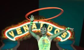 A performer with a hula hoop at Venardos Circus