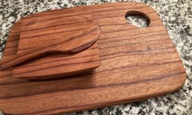 A cutting board and other kitchen items made from wood