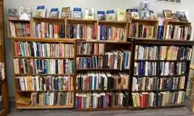 This wall of bookshelves in an African-American-owned bookstore includes new and used books