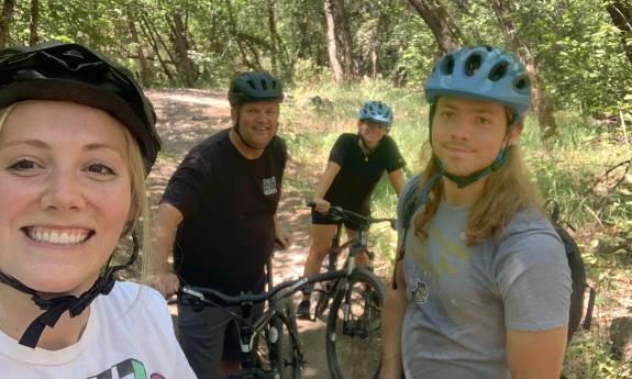 Four bikers pause on a trail in northeast Florida