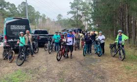 This group of adults are getting ready to ride a rough trail on the bikes delivered by Island Life Bikes