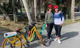 Two woman pause before starting a trip along a bike trail in northeast Florida