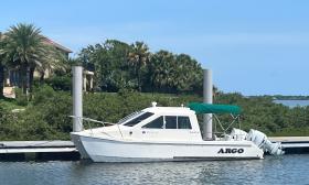 The power vessel Argo, on a dock in a St. Johns County river
