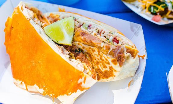 A Mexican UFO topped with a lime placed in a tray