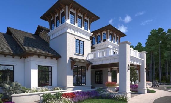 The Stillwater clubhouse with a white façade and wooden accents surrounded by flower beds