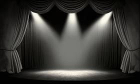 Black stage with black curtains and three spotlights
