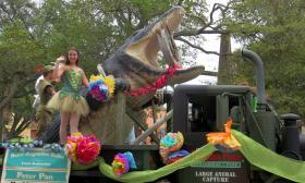 In the St. Augustine Easter Parade, a ballet troup stands on the Alligator Farm's float