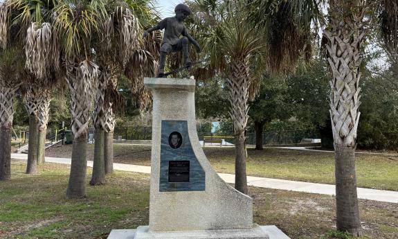 A skater statue and a plaque honoring Jordan Brent Angyalfy