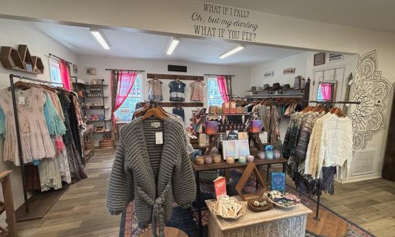 Clothes and accessories spread out inside the boutique