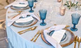 A close-up of table settings at a wedding reception in Renaissance Historic Downtown Hotel