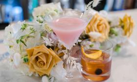 The bridal couples chosen drinks, arranged with wedding flowers