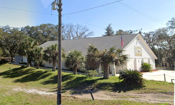 St. Augustine Shrine Club as seen from the exterior under a blue sky