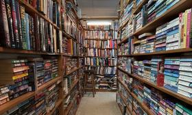 Rows of bookshelves offering different genres and authors