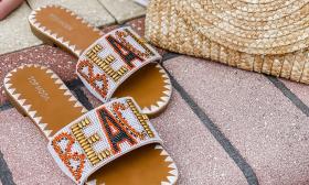 A pair of colorful, beaded beach sandals