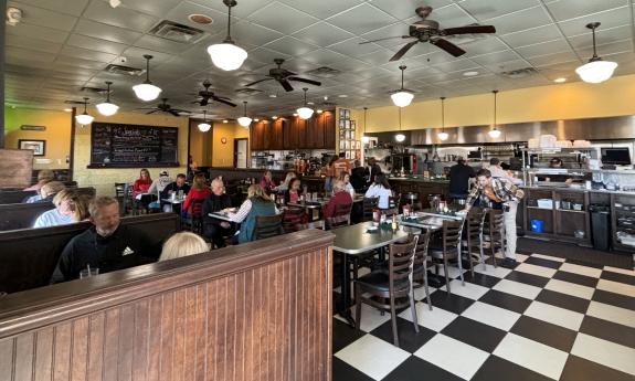 Tables and booths fill the space inside