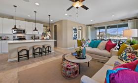A colorful and modern-looking living room and kitchen area