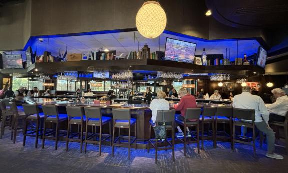 A full length bar sits at the entrance of the restaurant