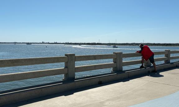 A man looking out over the water