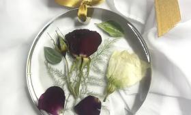 Floral arrangment preserved in a resin ornament