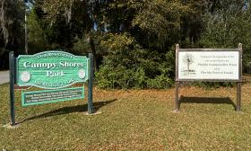 The Canopy Shores Park entrance sign