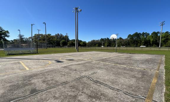 There is several basketball courts and bleachers