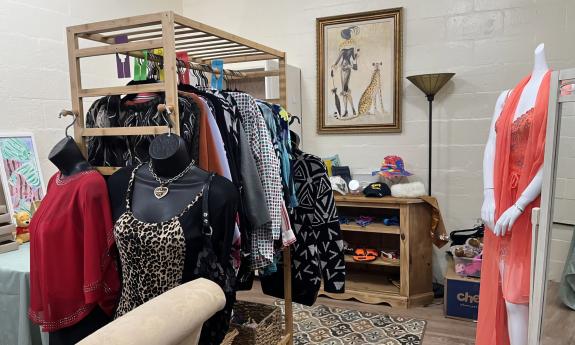 A rack of clothes inside the boutique