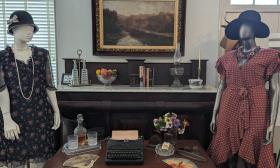 This display of the Hurston-Rawlings exhibit shows a dress each wore, and a typical desk set up for one of the writers