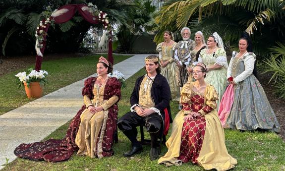 The past Queen, King, and Princess sitting at the ceremony