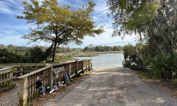 A dirt road leading into the water