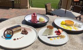 A variety of gourmet desserts presented on plates at Nineteen at TPC Sawgrass' outdoor patio