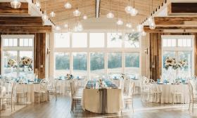 Indoor reception area with natural wood accents and panoramic views of the golf course at St. Johns Golf and Country Club