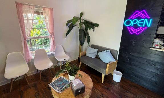 The indoor seating area with decor and a table in the middle