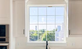 A view of the St. Augustine Lighthouse from the white kitchen of a Townhome at Cortez on the Water
