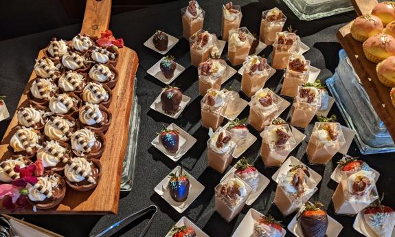 The dessert table at Taste of Golf with several types of desserts on display