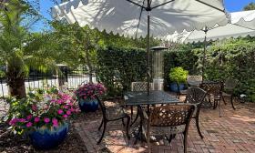 Shaded outside dining with flora and fauna surrounding