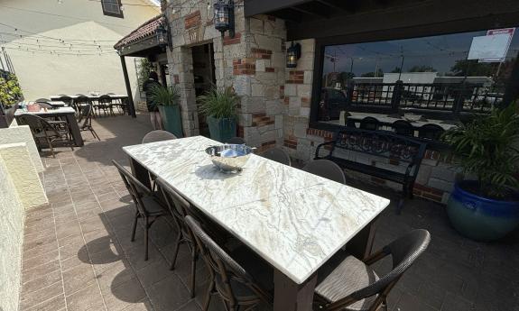 The outdoor patio has long tables for larger parties