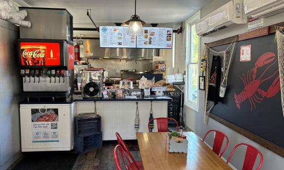 The restaurant's ordering counter with the menu overhead