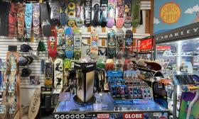 A collection of skateboards displayed on the wall