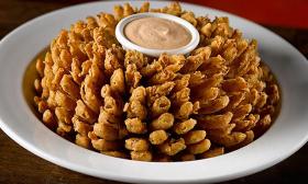 A bowl of the Cactus Blossom, fried onions with Cajun sauce