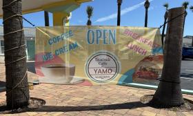 A banner advertising Beachside Caffe by YAMO 
