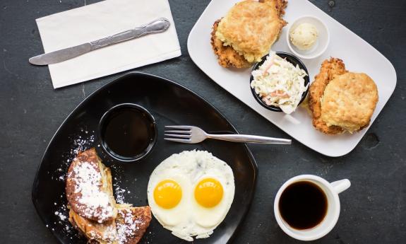 A spread of breakfast foods and coffee on the side