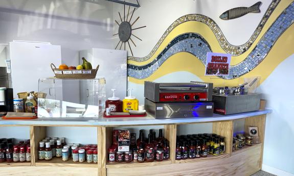 The counter for quick and easy fare and Datil pepper sauces on the shelves below