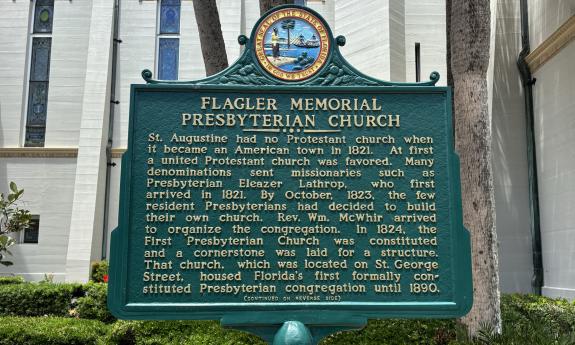 A plaque explaining the history of the church