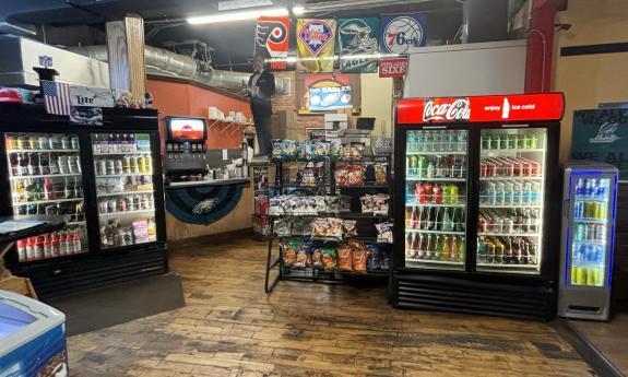 Various drinks and chips are on display