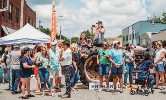 A crowd gathered on Main Street during the inaugural Cabbage, Potato, and Bacon Festival in Hastings, Florida