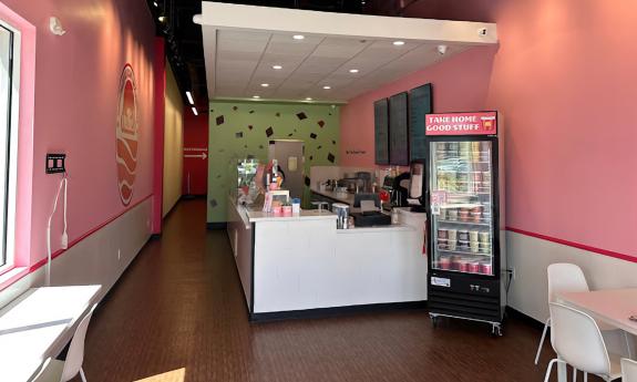 The inside of the the shop is decorated with bright pink walls