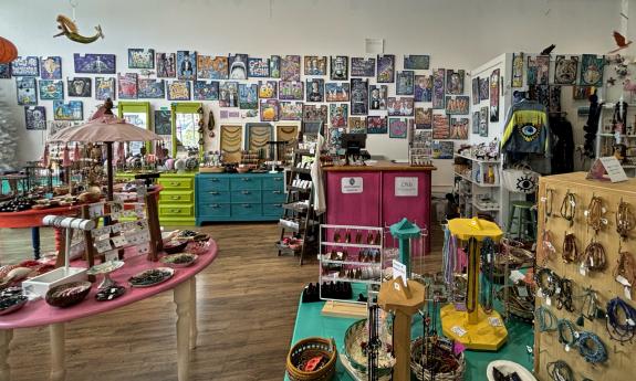The counter with artwork displayed on the back wall