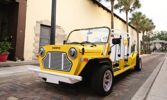 The six-passenger LiMoke, in bright yellow, on Aviles Street